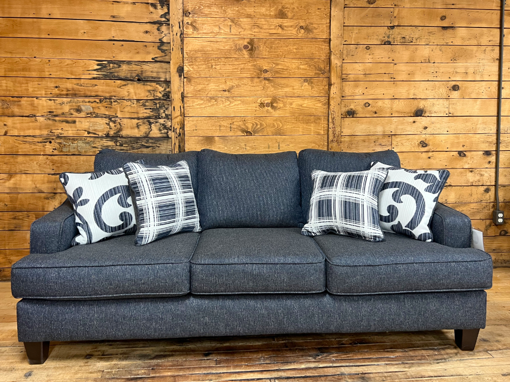 navy three seat sofa in the stock room furniture warehouse