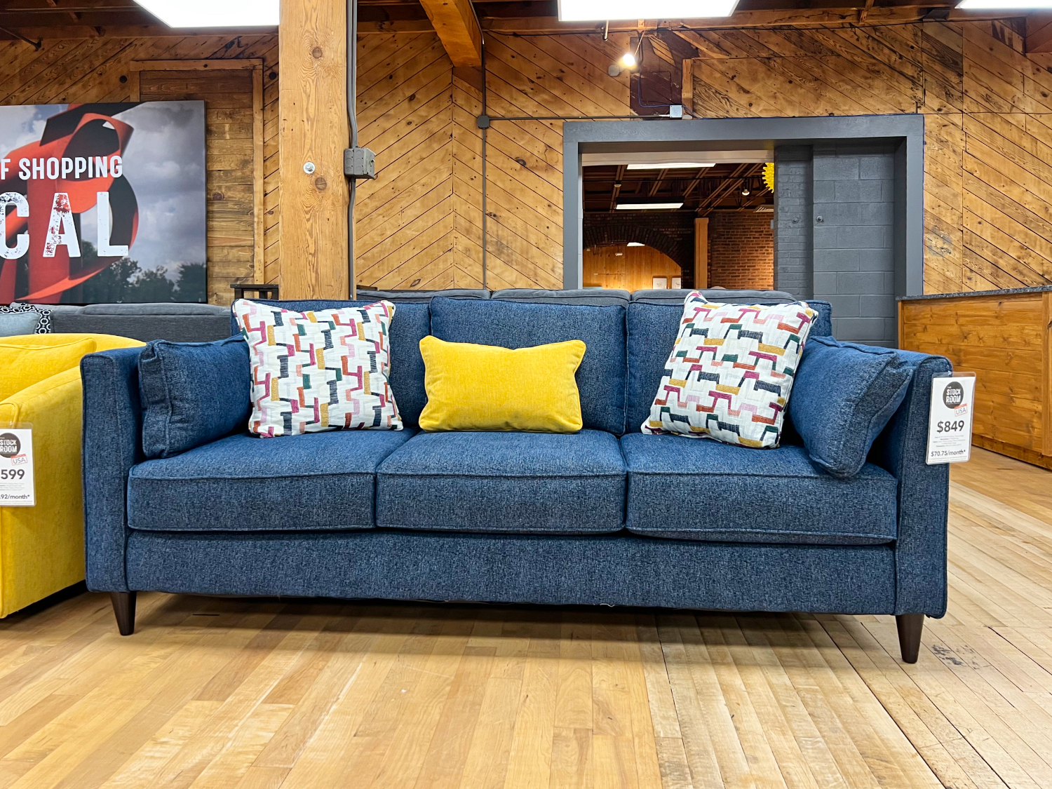 modern indigo blue track arm sofa in the stock room furniture warehouse in rockford, il