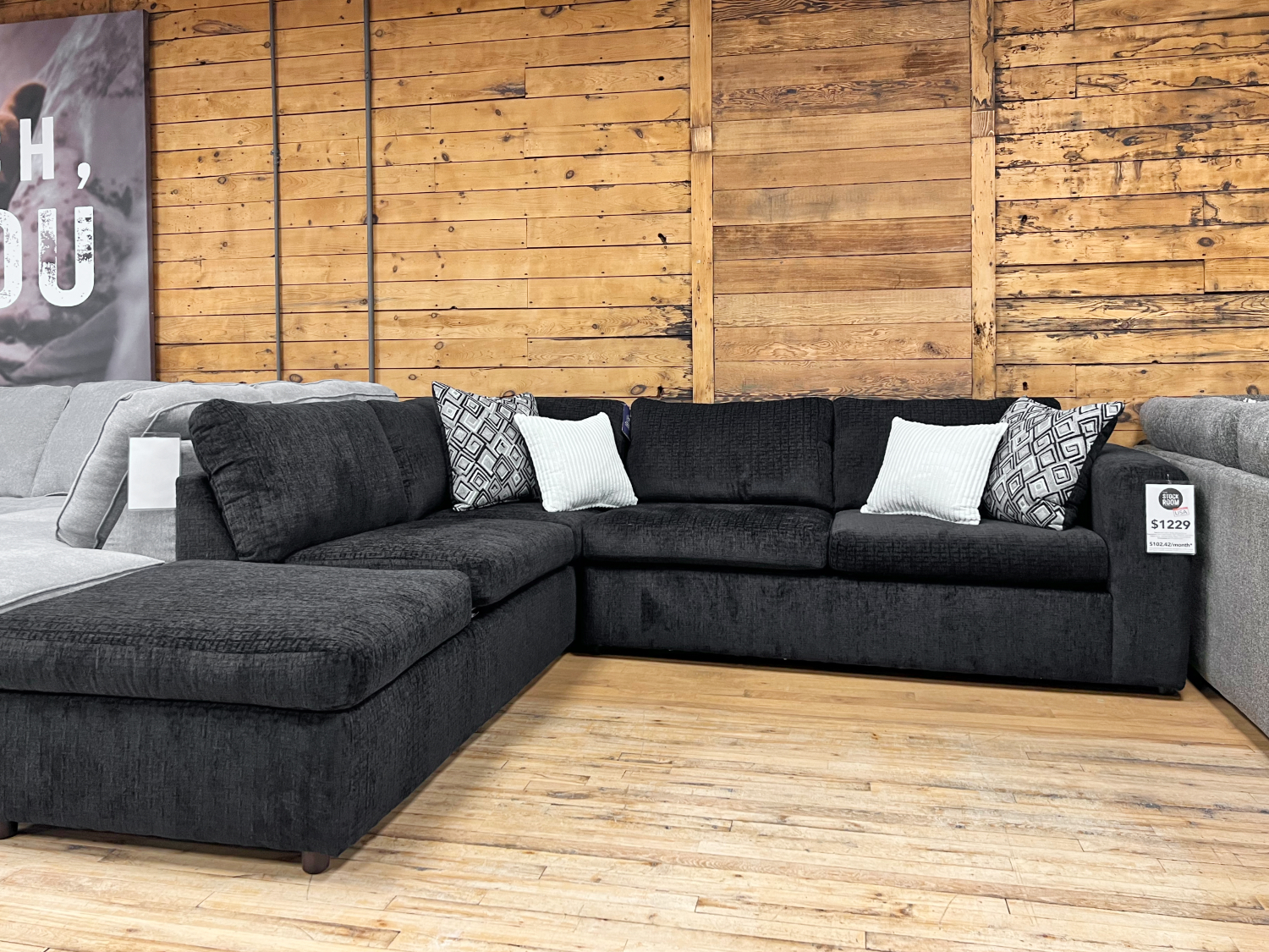 black l shape sectional in the stock room furniture warehouse in rockford, il