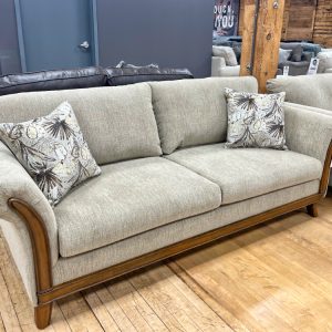 traditional sofa with splayed arms and hardwood trim at the stock room in rockford, il