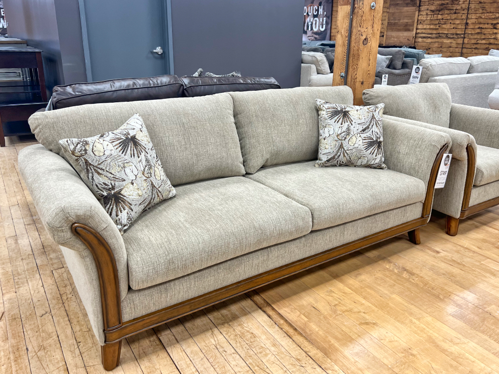 traditional sofa with splayed arms and hardwood trim at the stock room in rockford, il