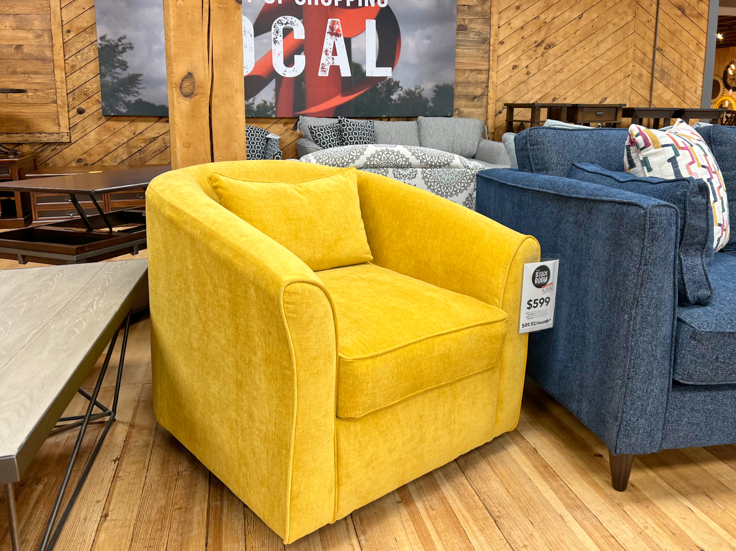 canary yellow swivel chair armchair in the stock room furniture warehouse in rockford, il