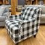 black and white plaid patterned accent chair in the stock room discount furniture warehouse