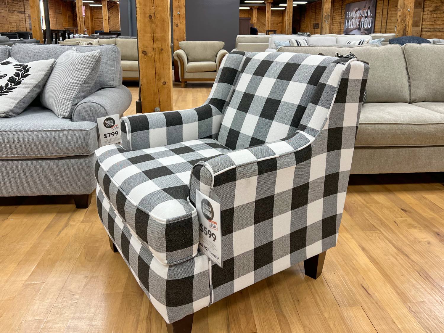 black and white plaid patterned accent chair in the stock room discount furniture warehouse