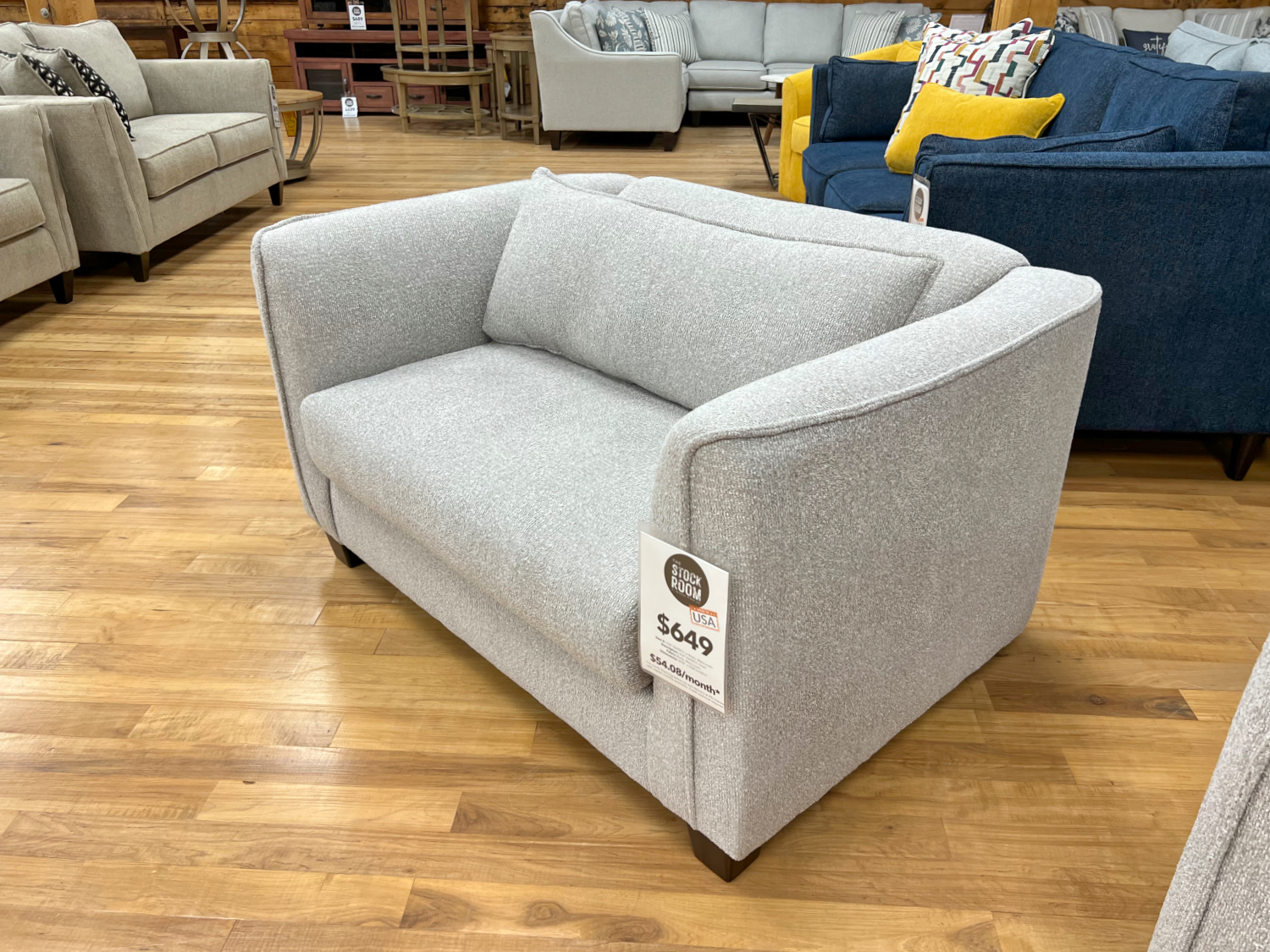 MCM armchair in grey upholstery at the stock room discount furniture factory in rockford, il