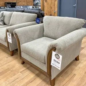 graceful beige armchair with hardwood frame in the stock room furniture warehouse