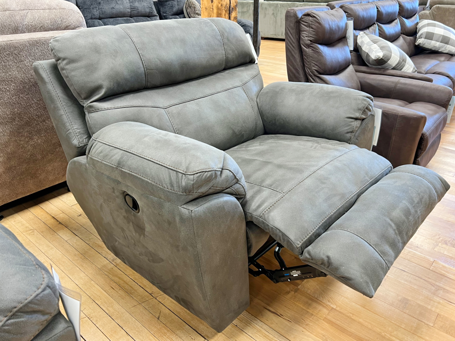 suede-look reclining armchair in the stock room discount furniture warehouse in rockford, il