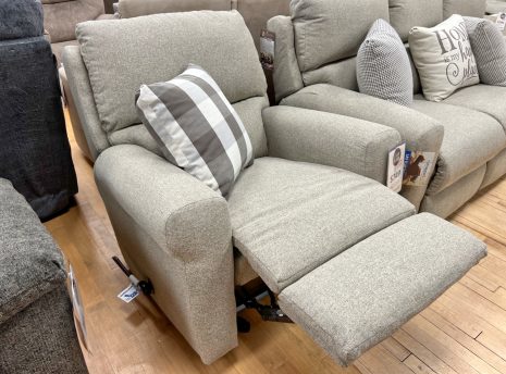 beige reclining chair in the stock room discount furniture warehouse in rockford, IL