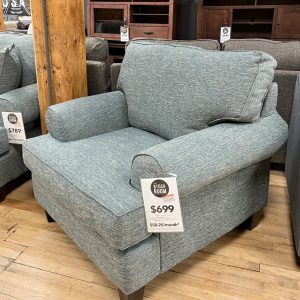 jade green armchair in the stock room discount furniture warehouse in rockford, il