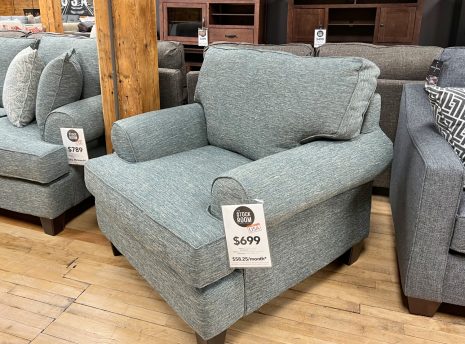 jade green armchair in the stock room discount furniture warehouse in rockford, il