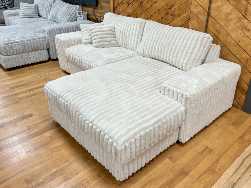 jumbo fluffy corduroy chaise sofa chofa in cream color in the stock room discount furniture warehouse in rockford, il