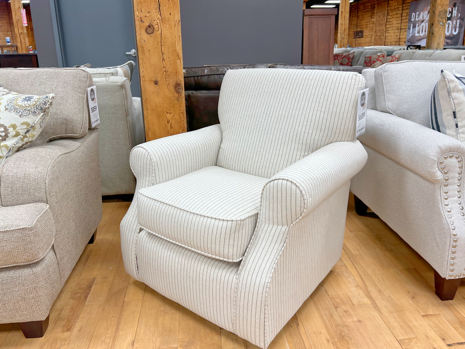 pinstripe swivel chair in cream color at the stock room discount furniture warehouse in rockford, il