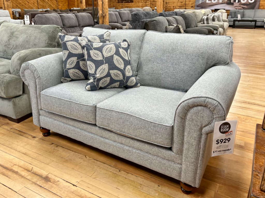 sky grey rolled arm loveseat in the stock room discount furniture warehouse in rockford, il