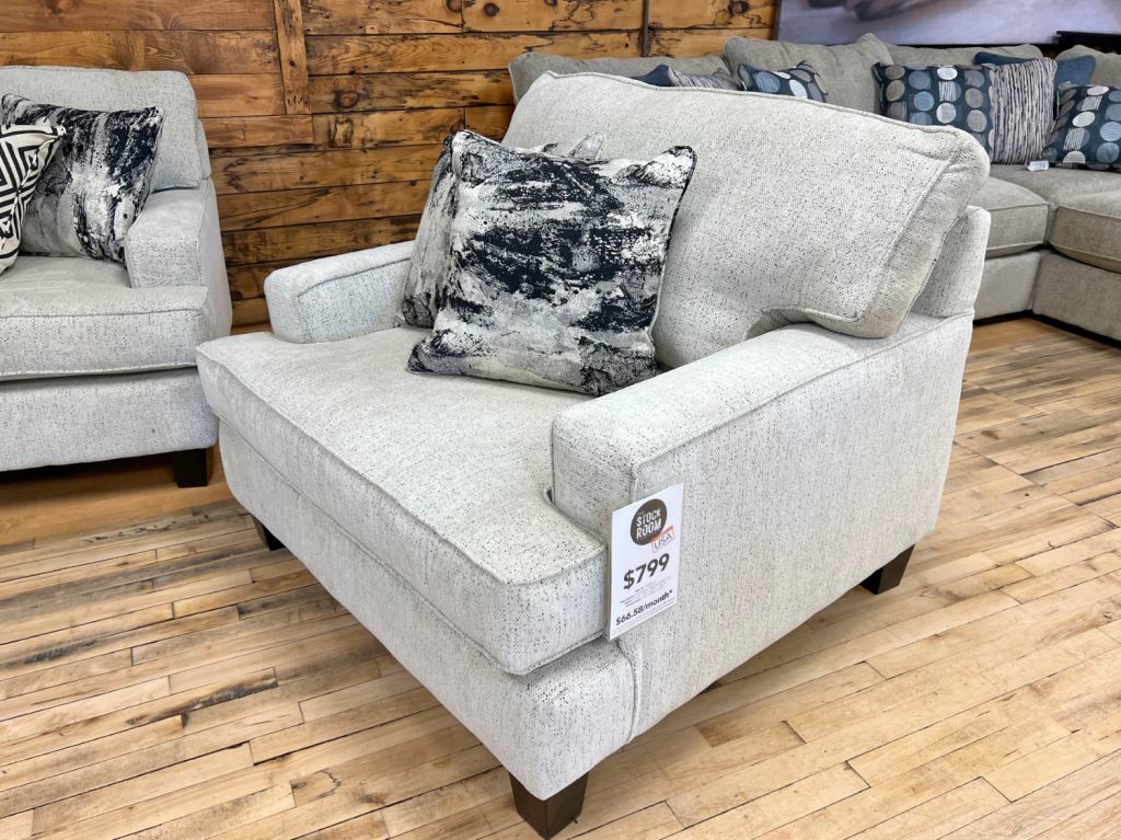 cozy contemporary chair and a half in a soft oatmeal off-white upholstery at the stock room discount furniture warehouse in rockford, il