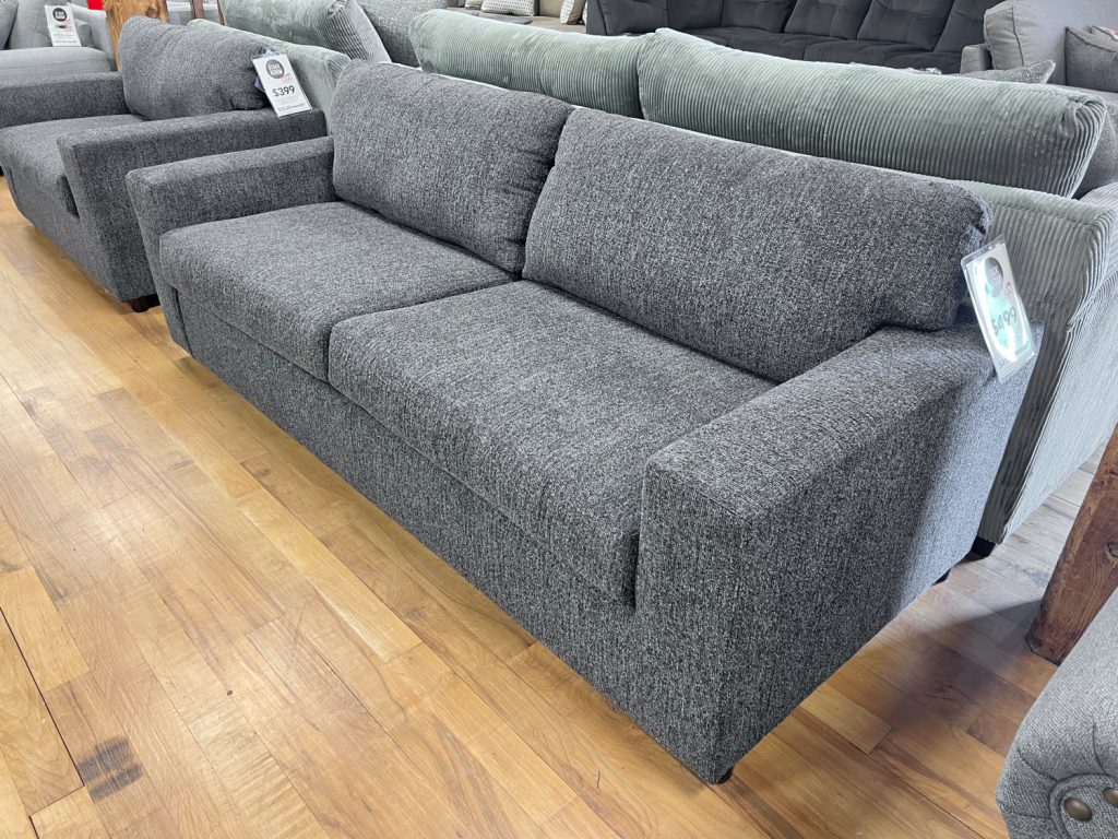 two seat wide track arm sofa in cozy charcoal fabric in the stock room discount furniture warehouse in rockford, il