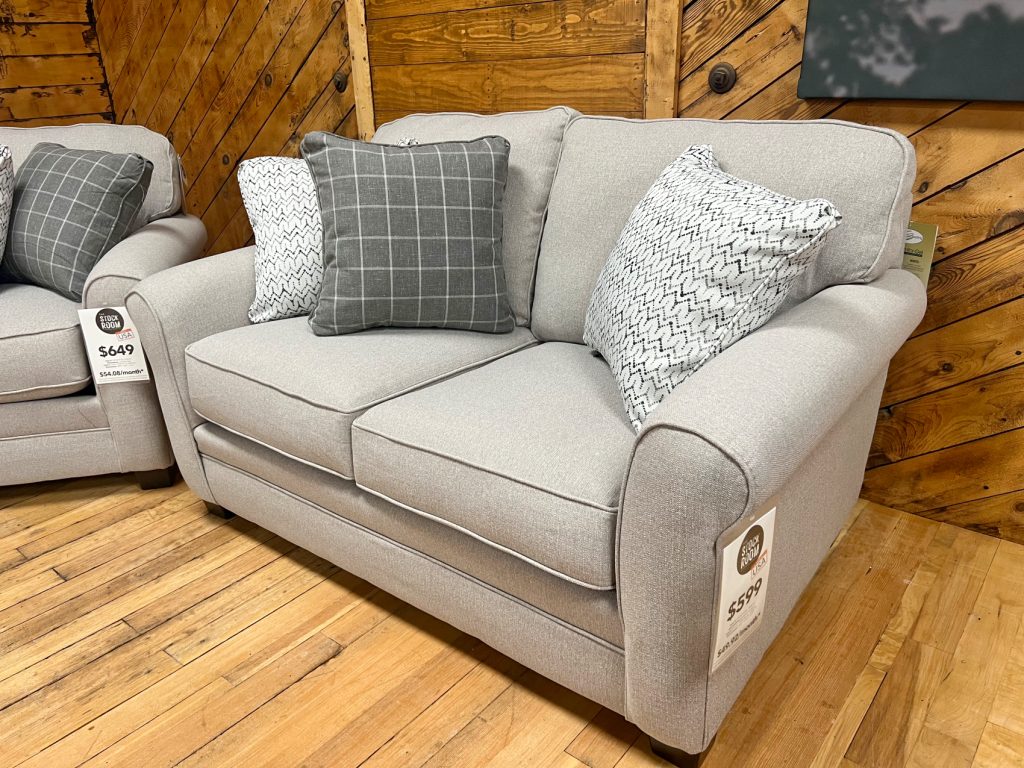 casual farmhouse loveseat in heathered gray fabric in the stock room discount furniture warehouse in rockford, il