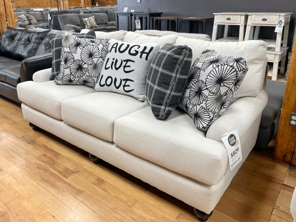 comfy chic three seat sofa in off-white ecru with black accents in stock and on sale in the stock room discount furniture warehouse in rockford, il