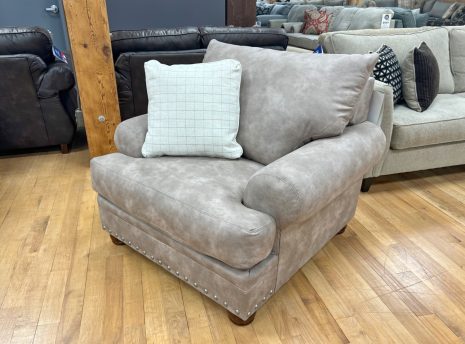 beige cottage sofa with nailhead trim in the stock room discount furniture store in rockford, il