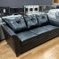 modern transitional black leather-look sofa in stock in the stock room discount furniture warehouse in rockford, il