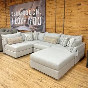 white linen look fabric modular sectional sofa in the stock room discount furniture warehouse in rockford, il