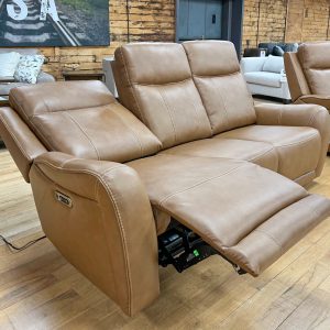 leather-look tan power reclining sofa at the stock room discount furniture warehouse in rockford, il