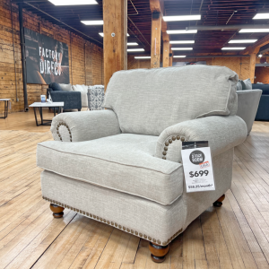 Traditional beige armchair with nailhead trim at The Stock Room furniture warehouse in Rockford, IL.